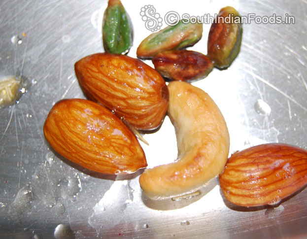 Heat ghee in a pan roast almonds, cashews & pistachios