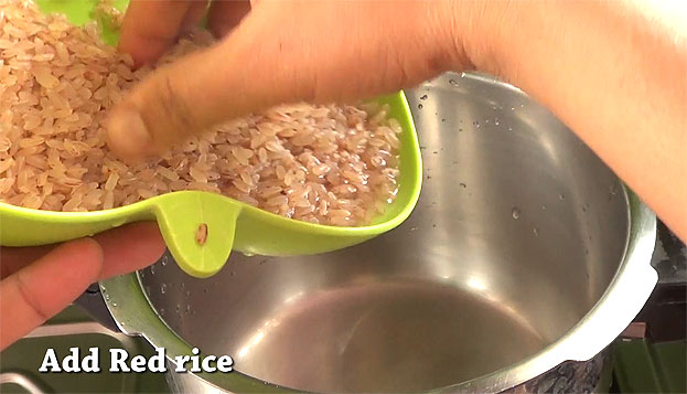 In a pressure cooker add soaked matta rice