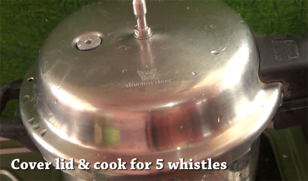 Cover lid, cook for 5 whistles