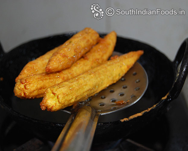 Crisp and golden brown baby corn fingers are ready, remove from oil, drain on absorbent paper