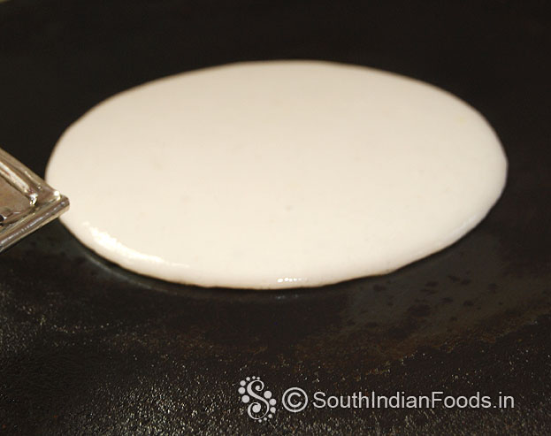 Heat iron dosa tawa pour dosa batter