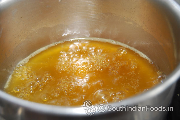 Jaggery melted and boiling, Now cut off heat & drain impurities