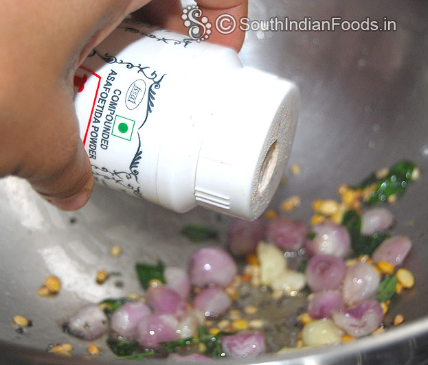 Heat 2 tbsp oil, add mustard, urad dal, chana dal, curry leaves, onion & asafoetida