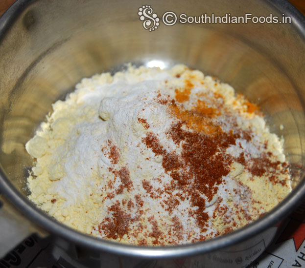 In a bowl add gram flour, rice flour, turmeric, red chilli powder, asafetida, salt mix well