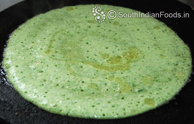 Heat iron dosa tawa, pour batter, spread immediatly