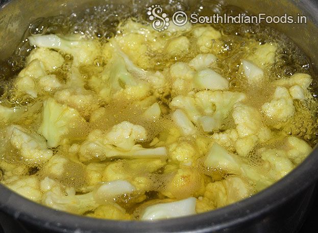 Boil cauliflower in salt & turmeric powder added water for 2 to 3 min then drain water