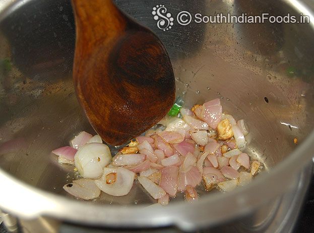Heat pressure cooker with oil then add onion garlic
