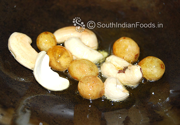 Heat ghee in a pan roast cashews & raisins
