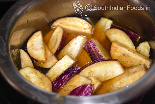Put chopped brinjal in turmeric added water, keep it aside