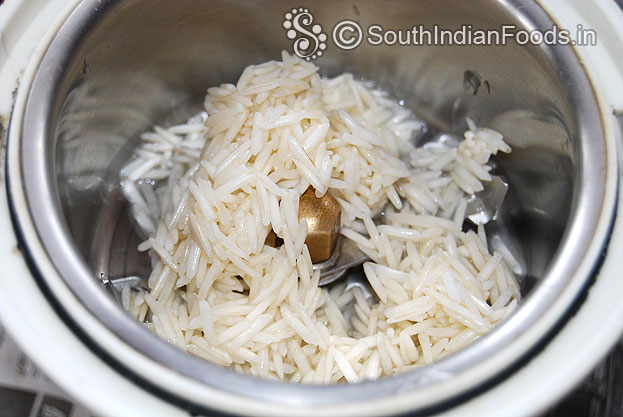 Add soaked basmati rice in a mixer jar, coarsely grind