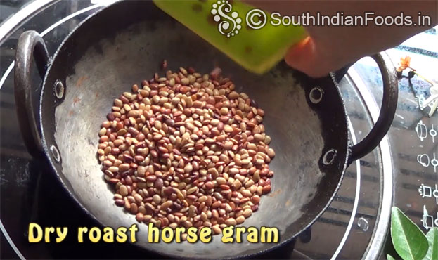 Heat pan, add horse gram