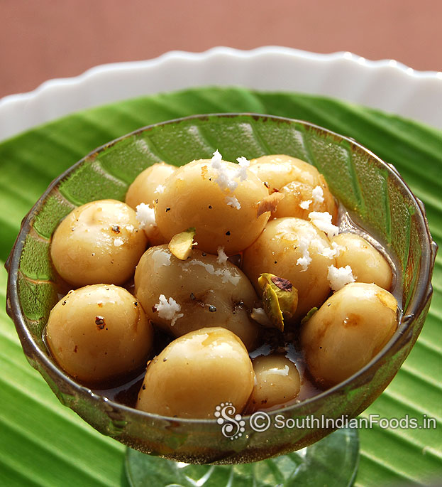 Sweet mani kozhukattai with jaggery is ready, add grated coconut & pistachios