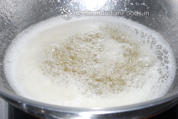 Once sugar fully melted, bubbles comes out and slightly thick-Perfect stage, now add fried donuts