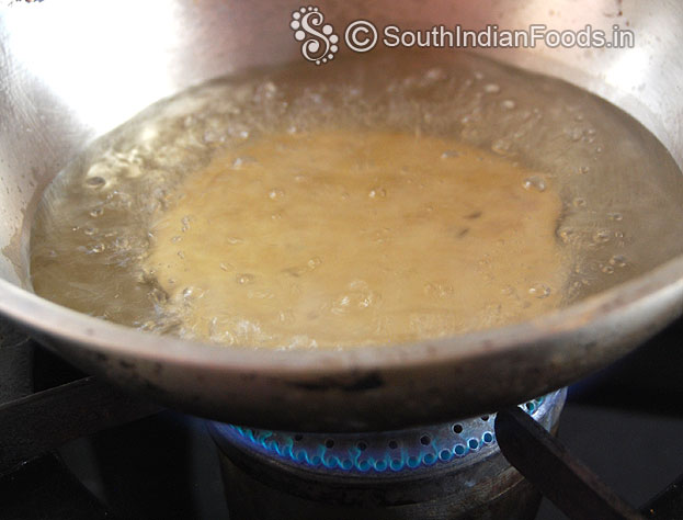 Heat oil in a pan put prepared raw mangalore bun deep fry till golden brown