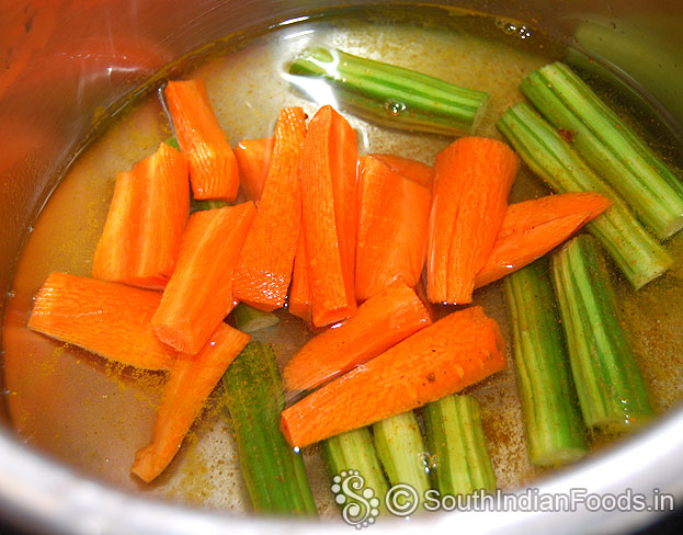 Boil drumstick, carrot with turmeric powder