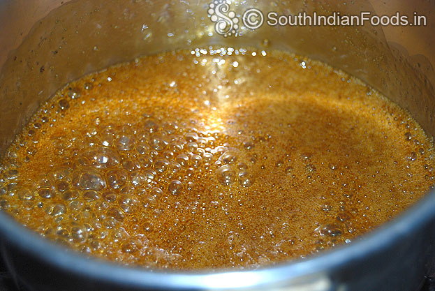 Jaggery is now boiling, let it boil till you get syrup consistency