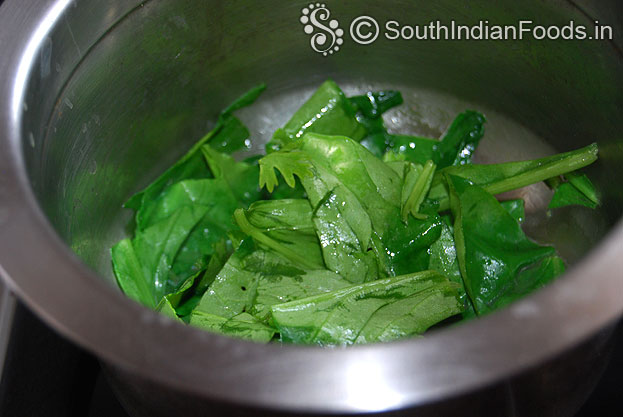 Heat oil in a pan, add spinach saute