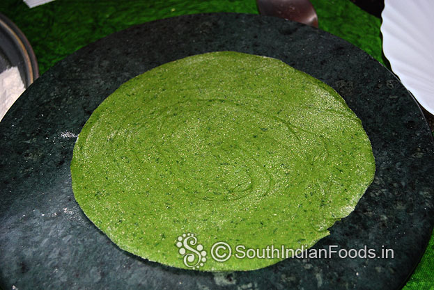 Sprinkle flour, roll out into thin or thick paratha