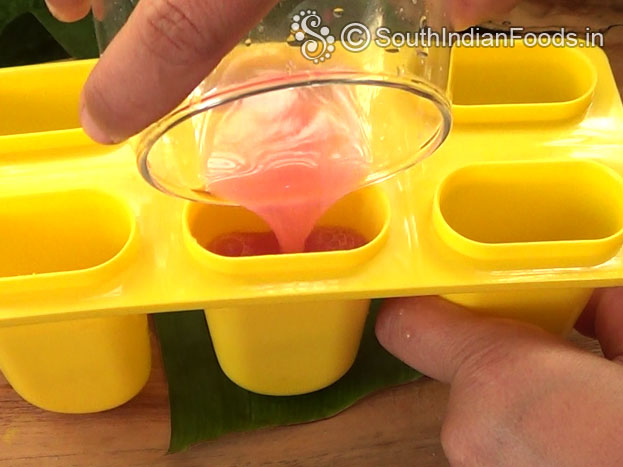 Pour pomegranate juice into pop ice moulds