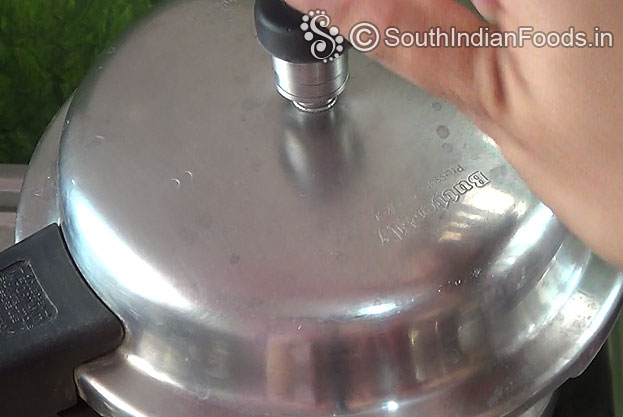 Cover lid, cook for 4 to 5 whistles