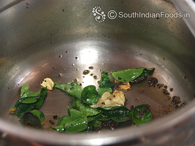 Heat oil, add mustard, garlic, curry leaves