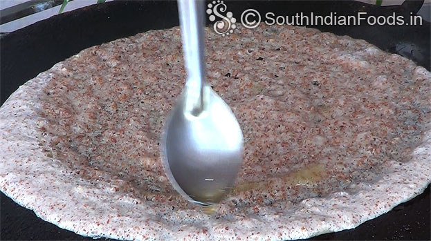 Pour oil around the dosa