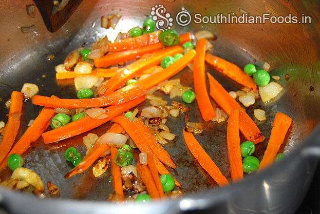 Heat oil in a pressure cooker add  garlic, onion saute well then addd carrot, green peas saute