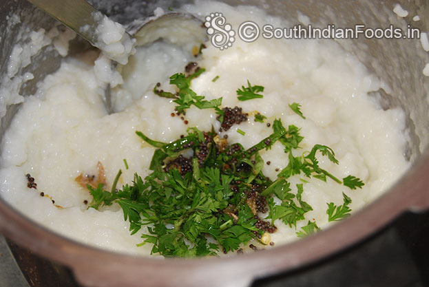 Add chopped coriander leaves [kothamalli] to curd rice
