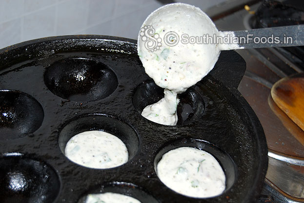 Heat iron paniyaram tawa, grease with oil, pour batter & fill cavity