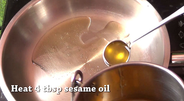 Heat pan, add sesame oil