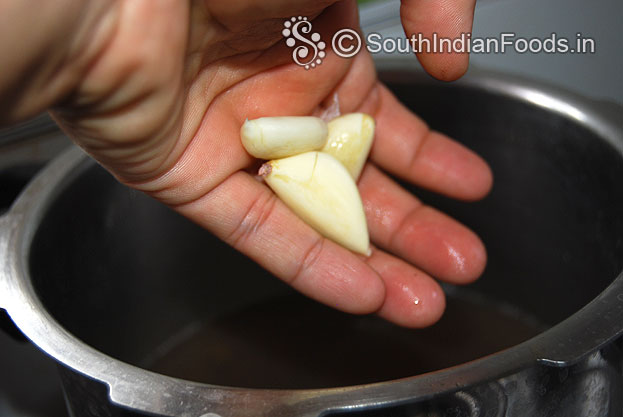 Add garlic in to the ulundu sadam