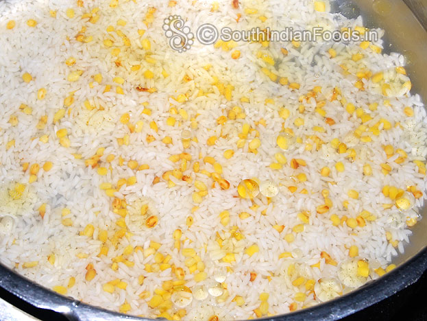 Wash & put rice, moongdal in a pressure cooker, Then add water & ghee, cover it & cooke for 4 whistles