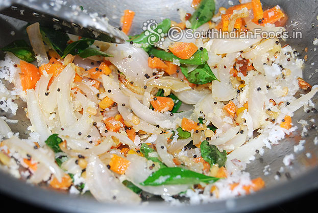 Add curry leaves, carrot & coconut saute