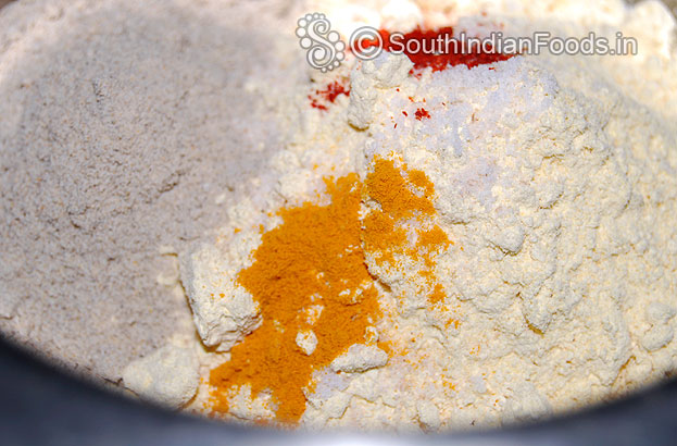 Add salt, asafetida, turmeric, red chilli powder and rice flour