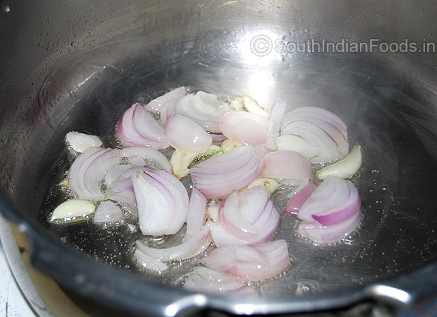 Heat pressure cooker with oil then add onion garlic