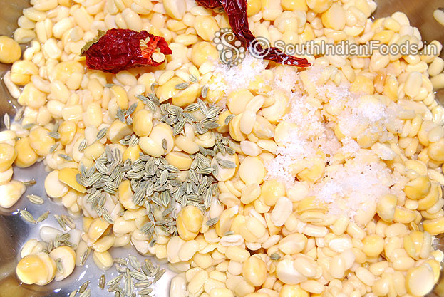 Add moong dal, bengal gram, dry red chilli, salt & fennel seeds in a mixer jar & coarsely grind