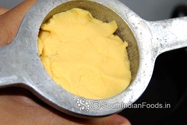In a muruku kuzhal-fill one handfull dough mixture
