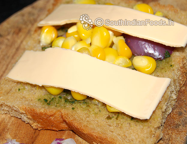 Place cheese slice, cover with another bread slice then grill.