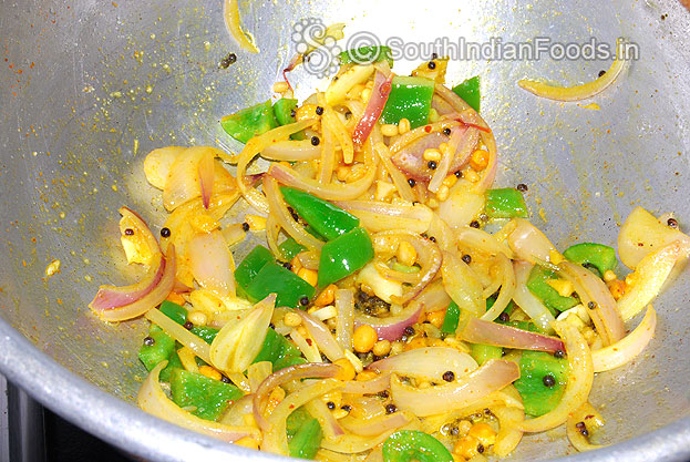 Heat oil in a pan add mustard, urad dal, bengal gram. Then add onion, ginger,garlic, green chilli, capsicum saute