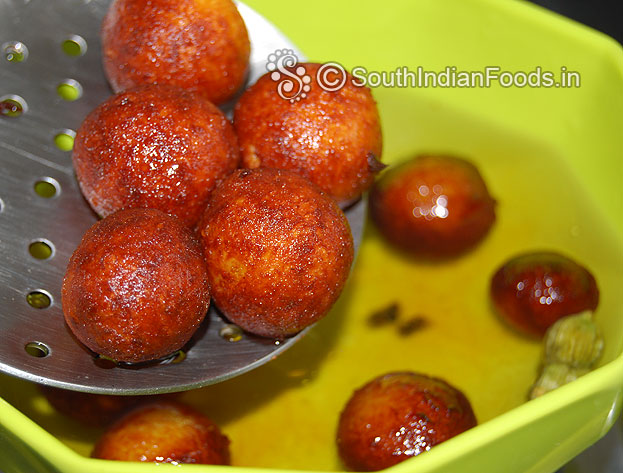 Add fried gulab jamuns to the warm sugar syrup & leave it for 1 hour