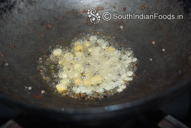 Heat oil in a pan, add mustard, urad dal & bengal gram fry till light brown
