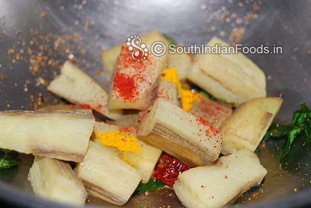Add boiled raw banana, turmeric and red chilli powder saute 