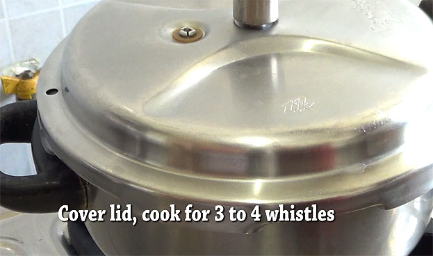 Cover lid, cook for 4 whistles