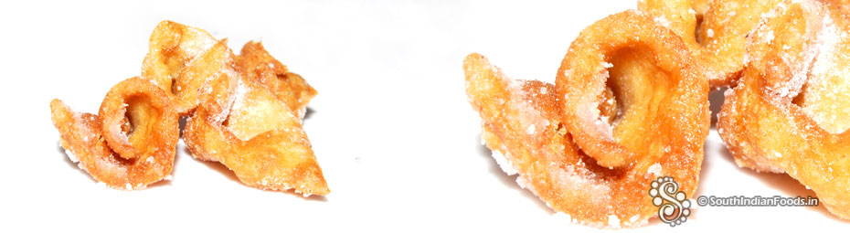 Crispy wheat biscuits with powdered sugar coating