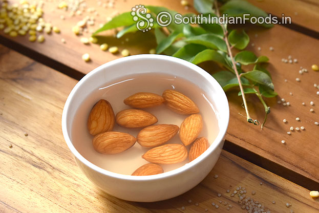 Soak almonds in hot water for 30 min