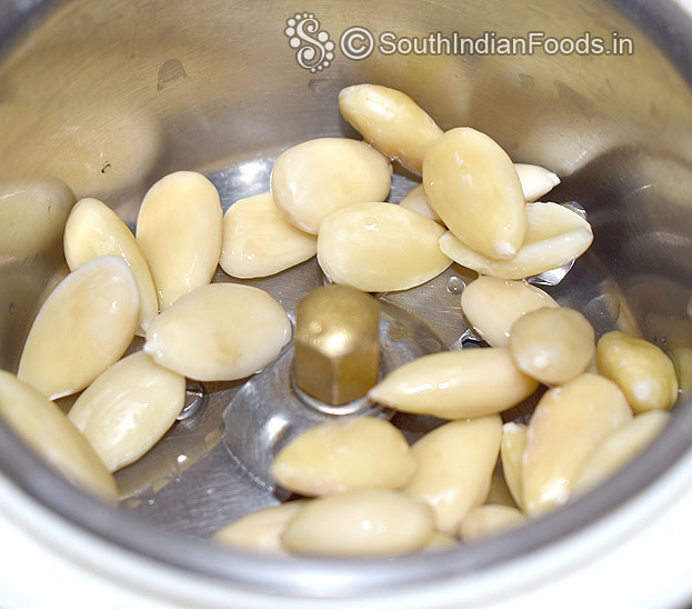 Add hot water soaked almond in a mixer jar