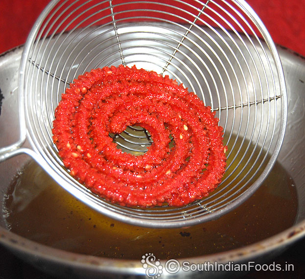 Crispy beetroot murukku ready, remove from oil