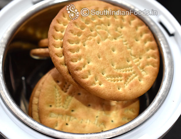 In a mixie jar add marie biscuit, coarsely grind