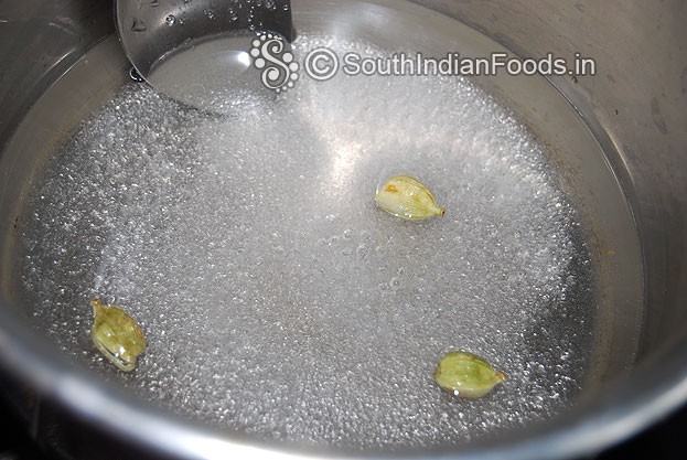 Add water, cardamom pods, mix well & let it dissolve then leave it for 5 min on medium to low flame