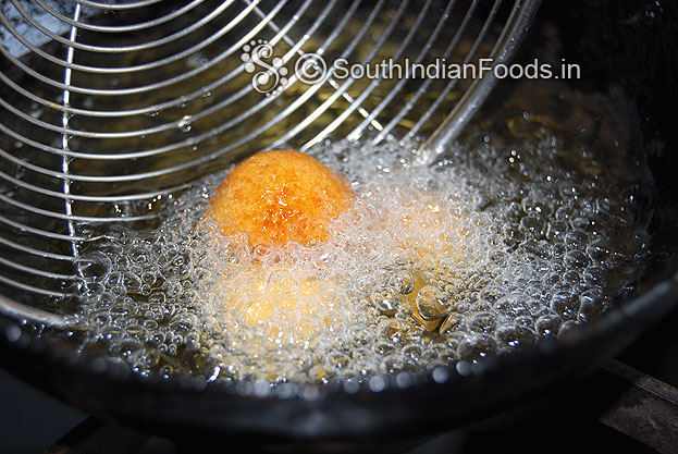 Heat oil in a pan add balls